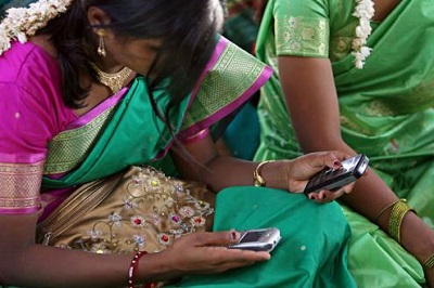 woman-reads-from-cell-phone india 0