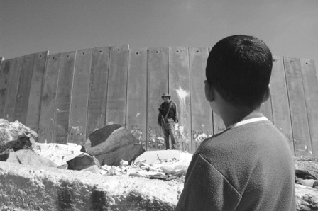 Boy and soldier in front of Israel